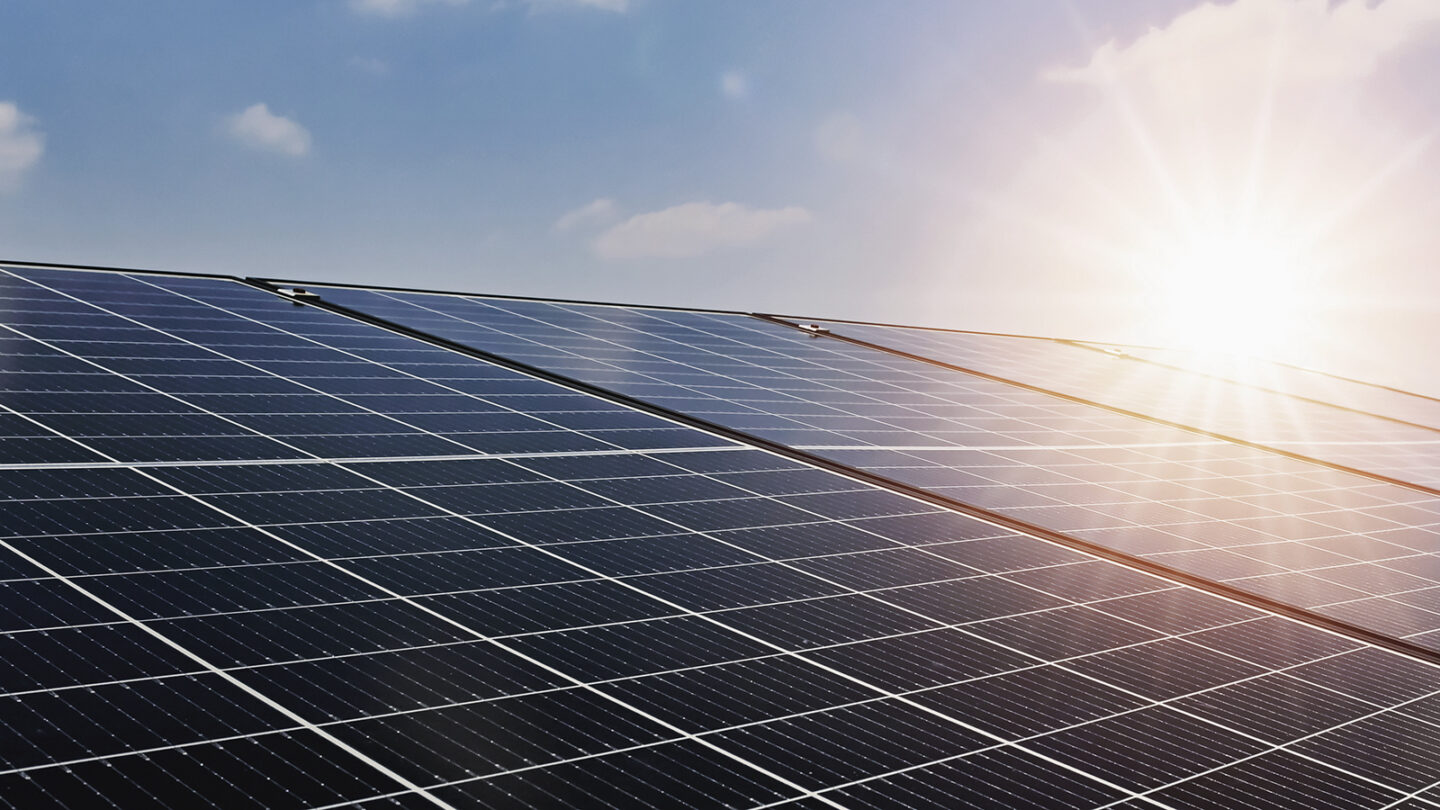 Solar panels with sunset and blue sky background. Clean power energy concept